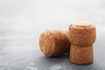 Champagne corks on grey wooden table