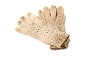 Knitted beige gloves isolated on white background