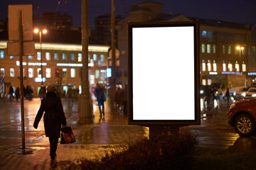 the ad billboard Billboard Ad Design, shines in the night city. mockup with a white field for...
