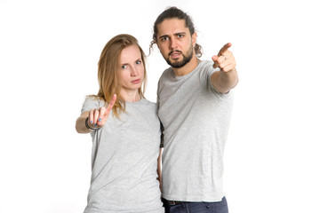 Fototapeta premium It is no. Two young people gesturing rejection. Couple man and woman not disagree, they put a symbol of denial in their hands.