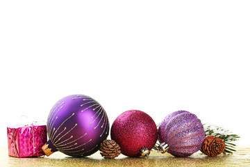 Christmas baubles with cones on bokeh background