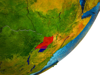 Uganda on 3D model of Earth with water and divided countries.
