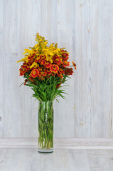 Bouquet of red and yellow flowers. Beautiful combination of colors. Mimosa. Bouquet of wild flowers.