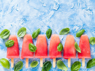 Top view of watermelon and basil popsicles with copy space. Popsicles recipe idea.
