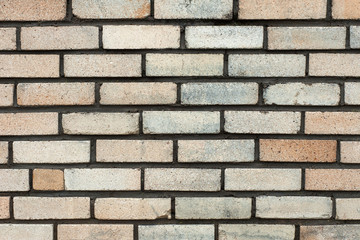 The old rectangular grey brick wall texture background.