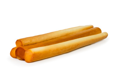 Sticks of smoked cheese closeup on a white. Isolated.