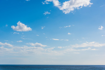 Naklejka na ściany i meble Cloudy sky over blue sea in Sardinia