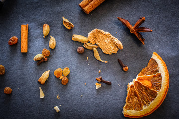 Spices on dark graphite craft paper
