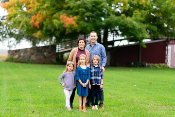 Family posing outdoors
