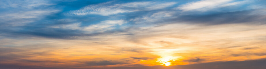 Naklejka na ściany i meble Orange and blue sky at sunset