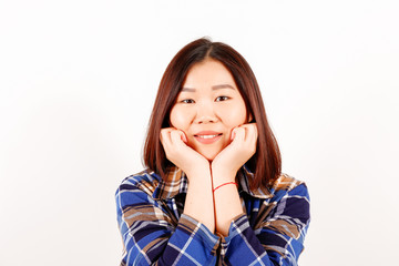 Fototapeta premium Portrait of beautiful asian young woman with brunette hair and bob hairstyle, fashionable hipster outfit alone in bright lighted room. Background, copy space for text, close up.