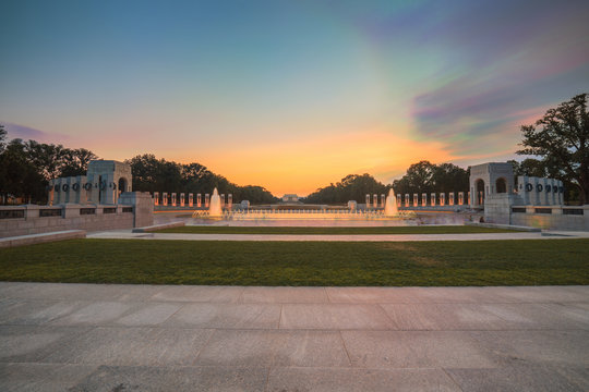 Landmark World War II Memorial fountains at the National Mall in Washington DC seen at sunset. Long Exposure HDR image.