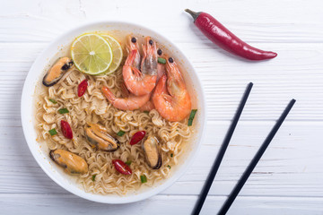 Instant noodles soup with shrimps and mssels . Asian food