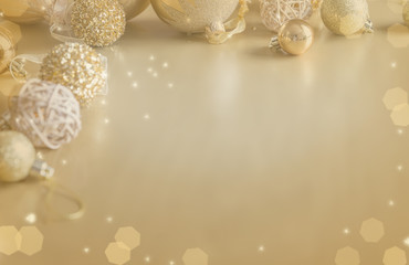 Fototapeta na wymiar Winter background. Christmas ball golden background. Christmas decoration. Toned effect
