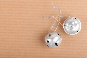 silver bells on brown background