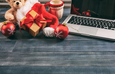Christmas decoration and a laptop on an office desk, copy space