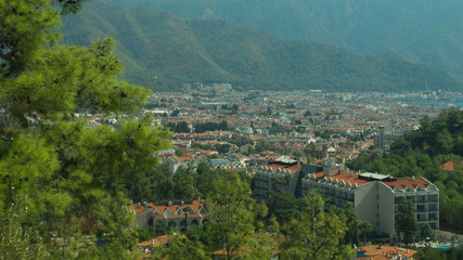 Fototapeta na wymiar Mountain town panoramic view. city between the hills