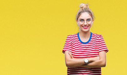 Young beautiful blonde woman wearing glasses over isolated background happy face smiling with crossed arms looking at the camera. Positive person.