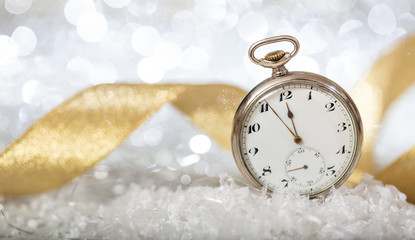 New Years eve. Minutes to midnight on an old fashioned pocket watch
