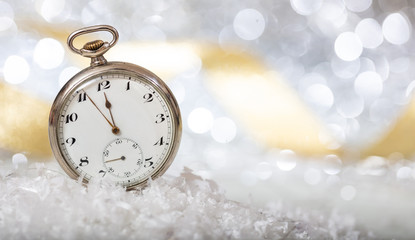 New Years eve. Minutes to midnight on an old fashioned pocket watch