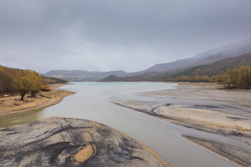 View of Barrea Lake almost dry, Lake Barrea, Abruzzo, Italy. October 13, 2017