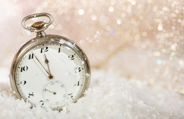 New Years eve. Minutes to midnight on an old fashioned pocket watch