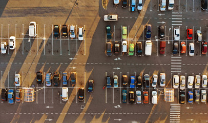Aerial. Parking lot with cars at sunset. © Dmytro