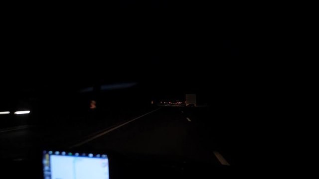 Night track from the passenger compartment, navigator. Night run from the car. Travel using the dark streets navigator.