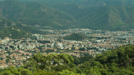 Mountain town panoramic view. city between the hills