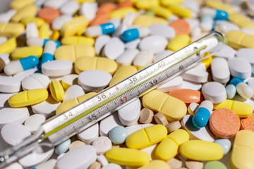 thermometer and coloured tablets for treatment of diseases