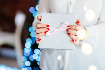Woman holding present.