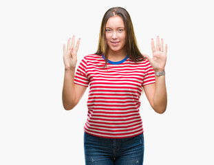Young caucasian beautiful woman over isolated background showing and pointing up with fingers...