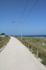 Old railway line, today hiking trail in Syracuse at the Mediterranean Sea, Sicily Italy