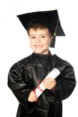A Young boy 4 years old in graduation dress for the nursery class