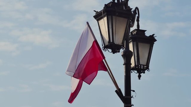 flag of Poland on the street lamp during national holiday