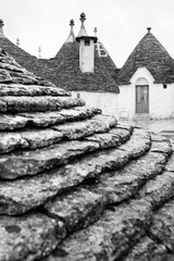 black and white photography of roof and old houses in Alberobello in Puglia in Italy