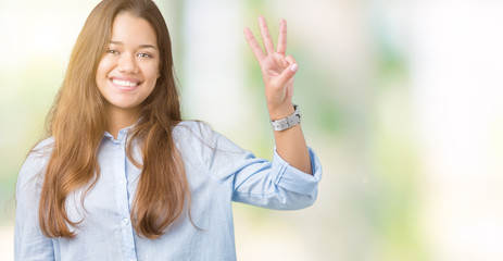 Young beautiful brunette business woman over isolated background showing and pointing up with...