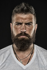 Brutality and masculinity. Man bearded hipster serious face close up. Brutal man with over...