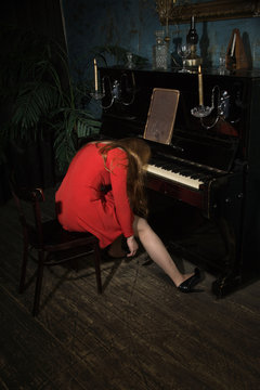 Unconcsious beauty woman at the piano