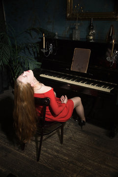 Unconcsious beauty woman at the piano