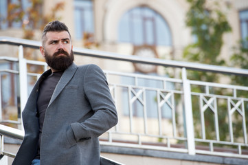 Fototapeta premium Man bearded hipster stylish appearance waiting someone. Confident hipster. Hipster confident waiting meeting outdoors. Bearded hipster wait partner. Casual and comfortable outfit for autumn date