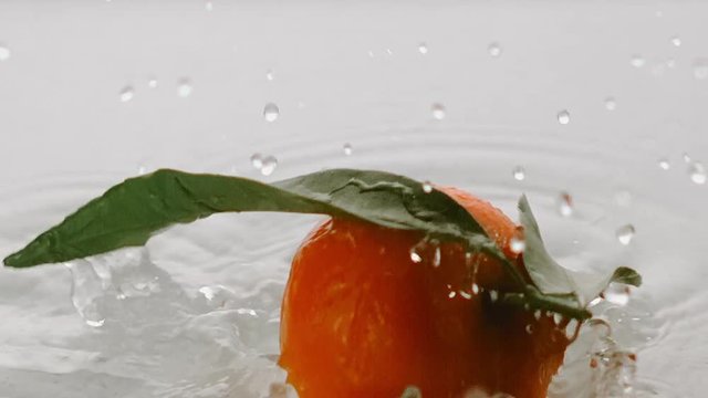 clementine falling in water with splashers