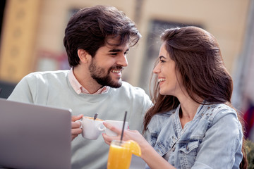 Happy couple spending time at coffee shop