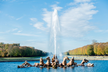 View at big fountain with gods and oak alley and lake on background. Autumn season time,...
