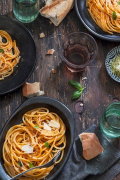 Pasta al Pomodoro (noodles with tomato sauce, Italy) with wine and bread