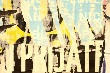 Fototapeta premium Old grunge ripped torn vintage collage posters creased crumpled paper surface placard texture background backdrop empty space for text letter 