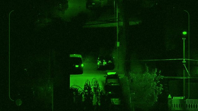 Night Vision Tracking Car Driving Near Apartments