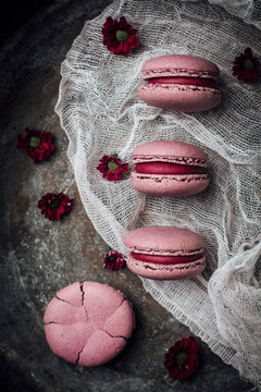 Overhead view of pink macarons on muslin cloth