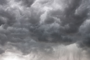 Fototapeta premium Dramatic cumulus storm clouds with rain