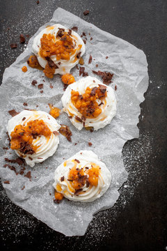 Mini pavlovas with cloudberries and chocolate